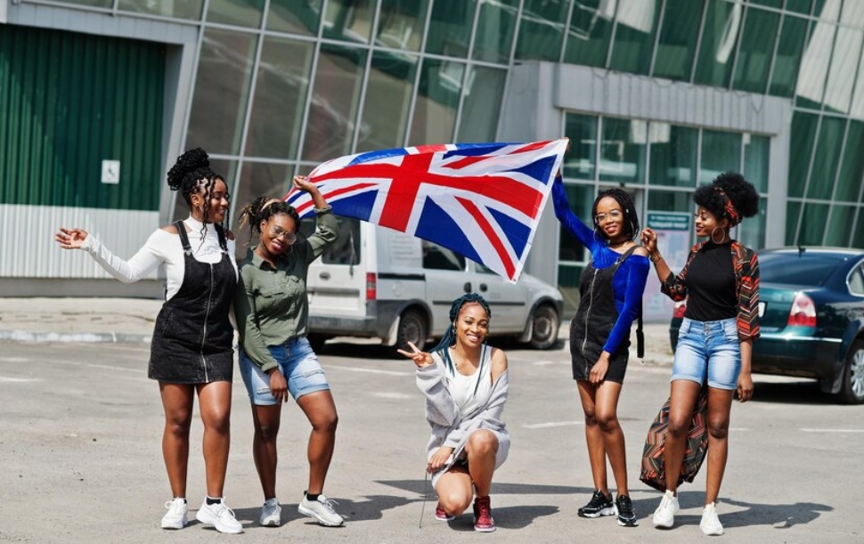 group-five-african-american-woman-walking-together-parking-with-great-britain-flag_627829-503